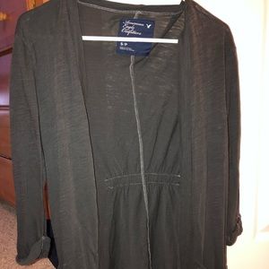 A dark grey cardigan